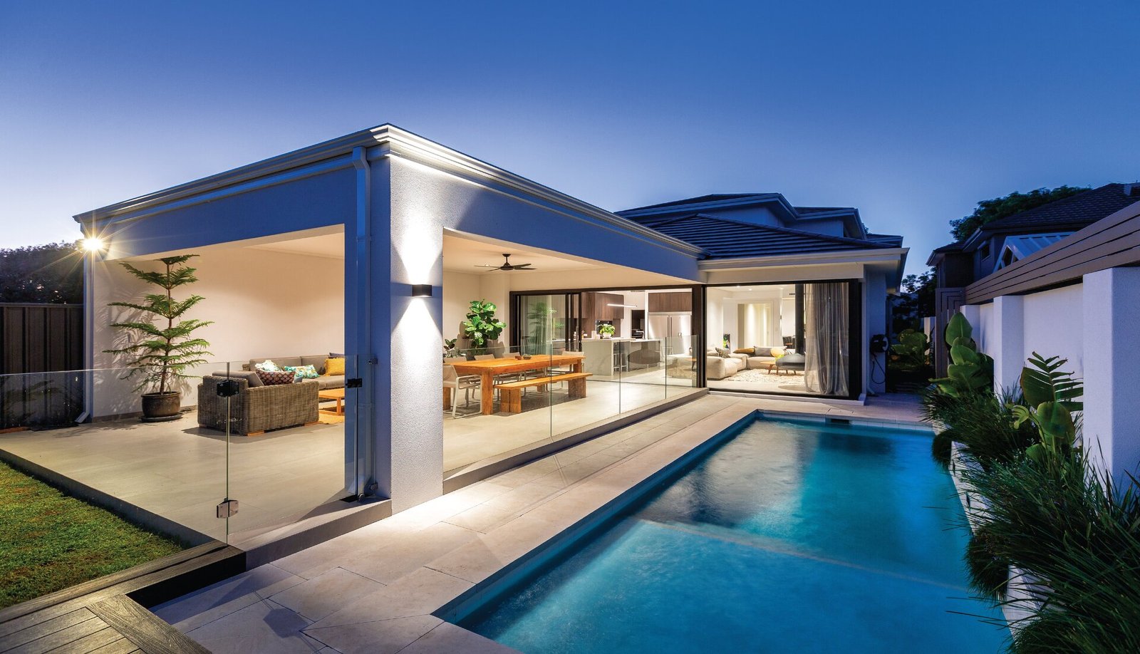 A sleek modern residence with a pool and patio, highlighting distinct home features for luxurious living.